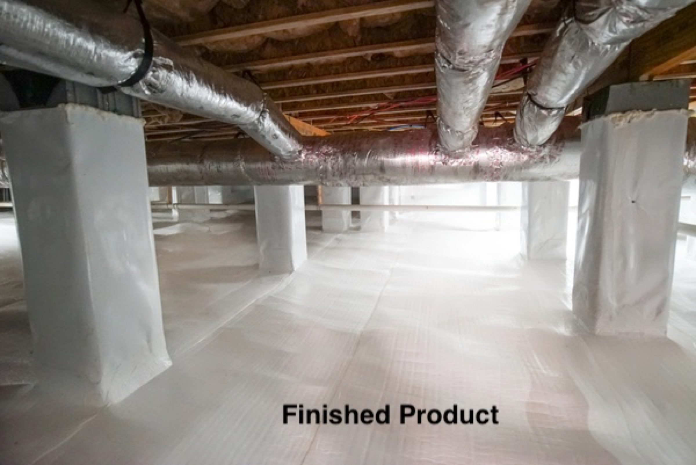 Completed crawlspace with sealed vapour barrier over the ground and up the piers