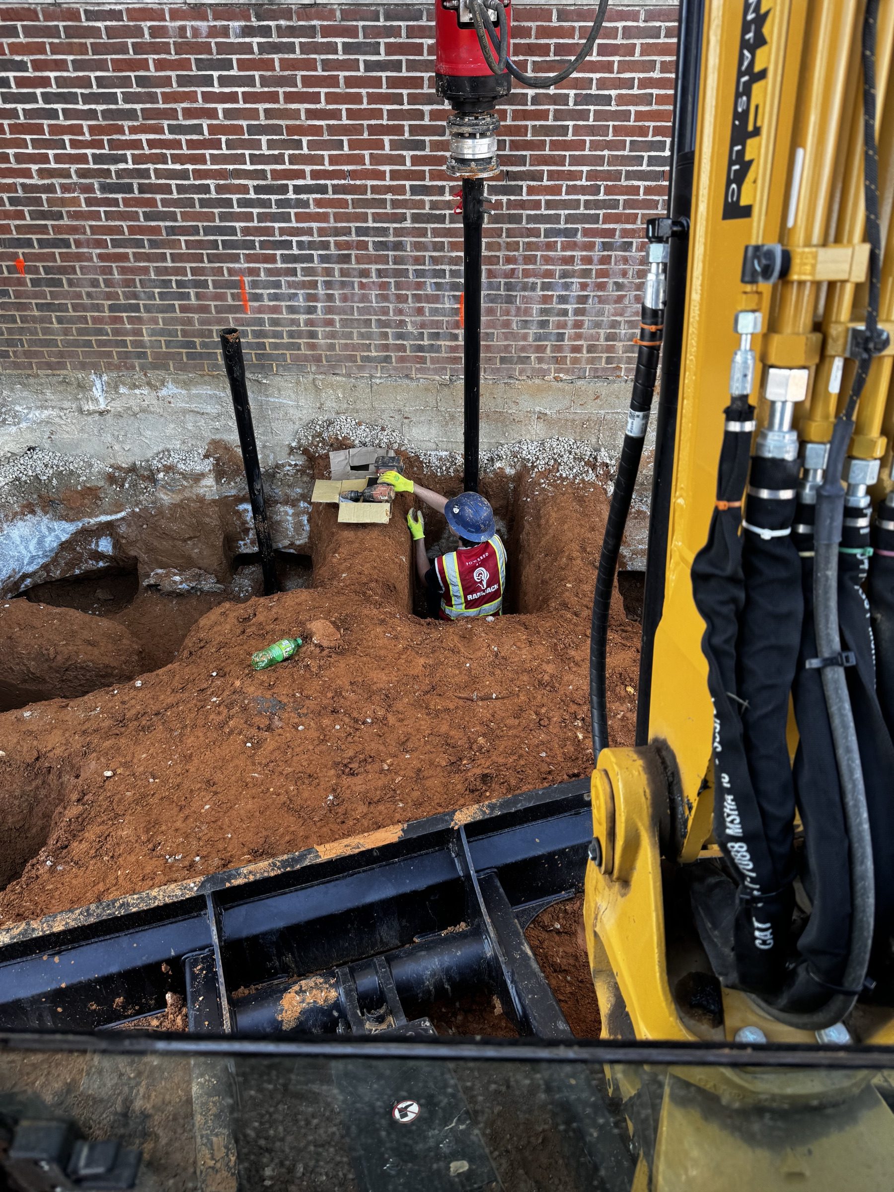 Helical drive head working a pit against a brick wall
